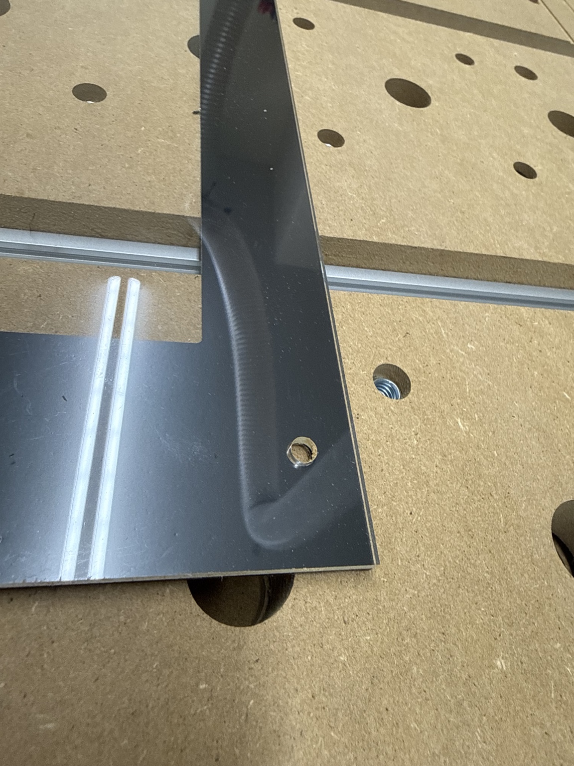 Close-up of a mounting hole and finished edge on Gary's black ABS marquee display mask