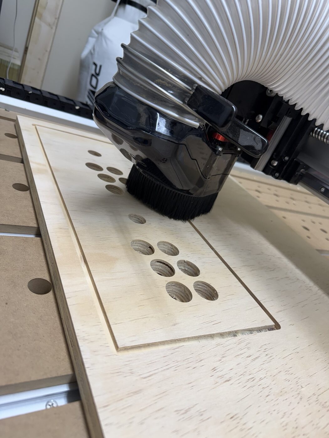 Router cutting the replacement plywood arcade control panel